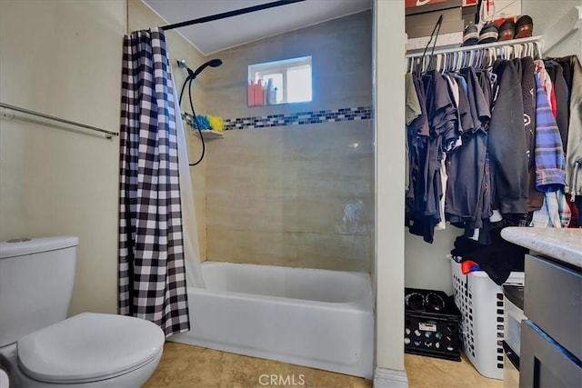 full bathroom featuring vanity, toilet, tile patterned flooring, and shower / bath combo with shower curtain