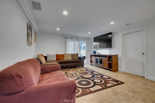 living room featuring crown molding