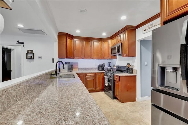 kitchen with appliances with stainless steel finishes and sink