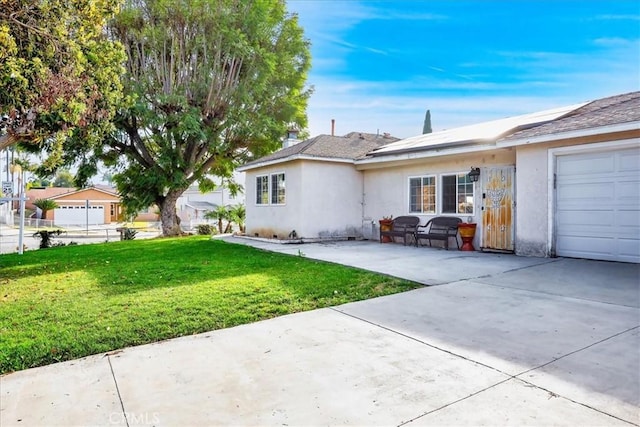 exterior space featuring a garage and a front yard