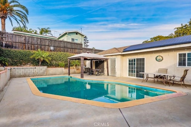 view of swimming pool with a gazebo and a patio area