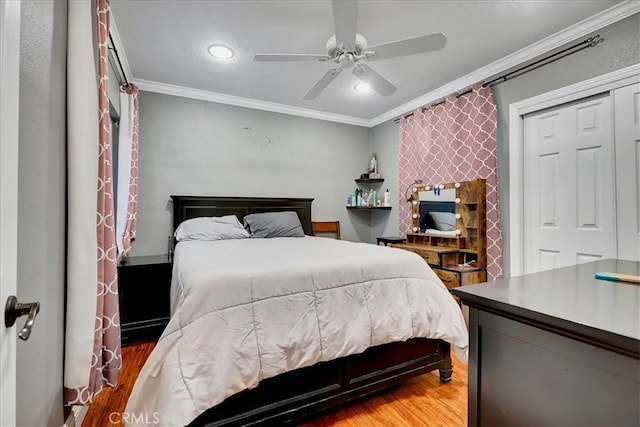 bedroom featuring crown molding, ceiling fan, and hardwood / wood-style flooring