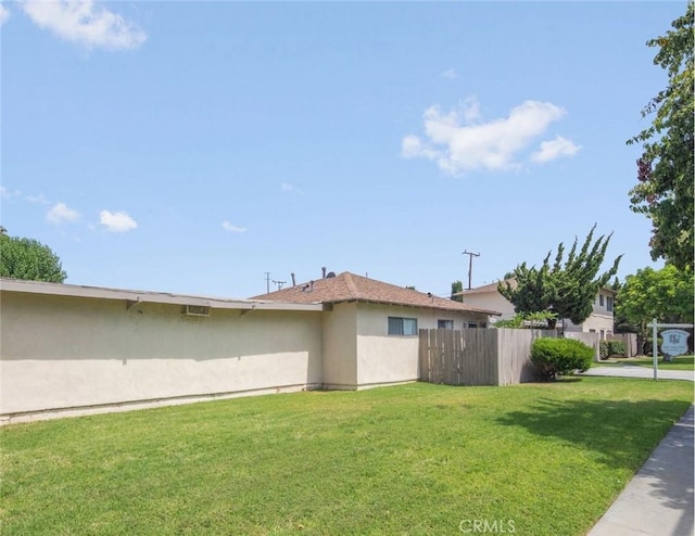 view of home's exterior with a lawn