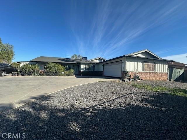 ranch-style home featuring a garage