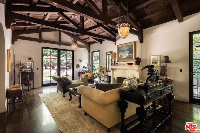 living room with wood ceiling, beamed ceiling, dark hardwood / wood-style floors, and a tiled fireplace