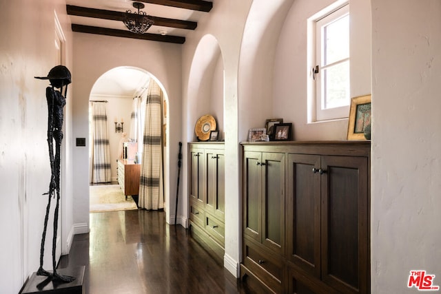 hallway with dark hardwood / wood-style floors and beam ceiling