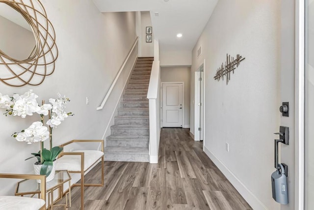 foyer entrance with hardwood / wood-style floors