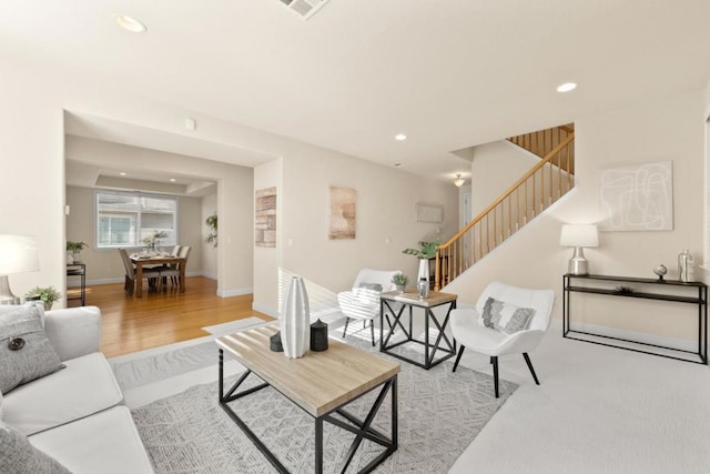 living room with light hardwood / wood-style flooring