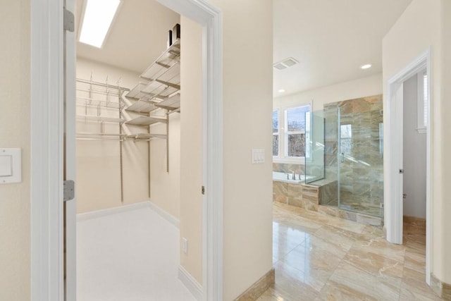 bathroom featuring separate shower and tub