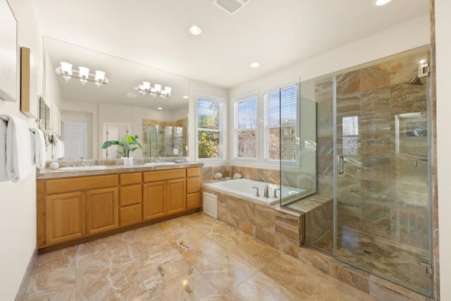 bathroom featuring vanity and separate shower and tub