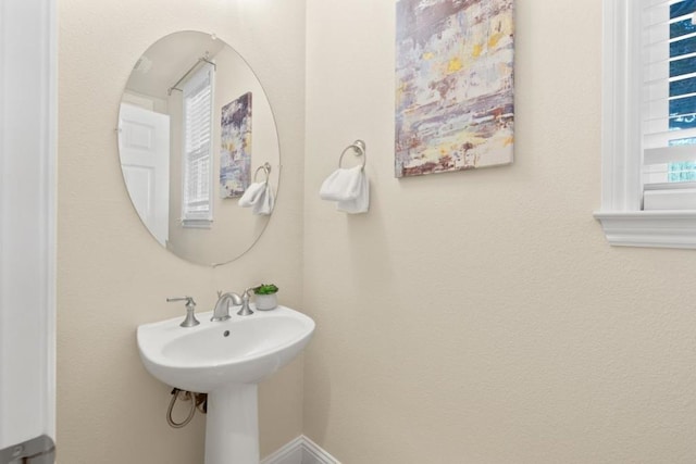 bathroom with sink and a wealth of natural light