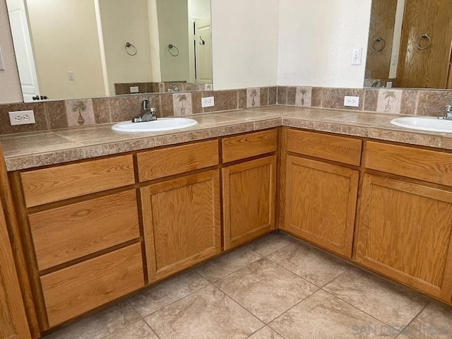 bathroom featuring tile patterned floors and vanity