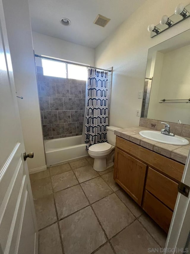 full bathroom with toilet, vanity, and shower / bath combination with curtain