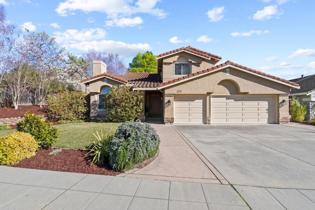 mediterranean / spanish-style house featuring a front yard