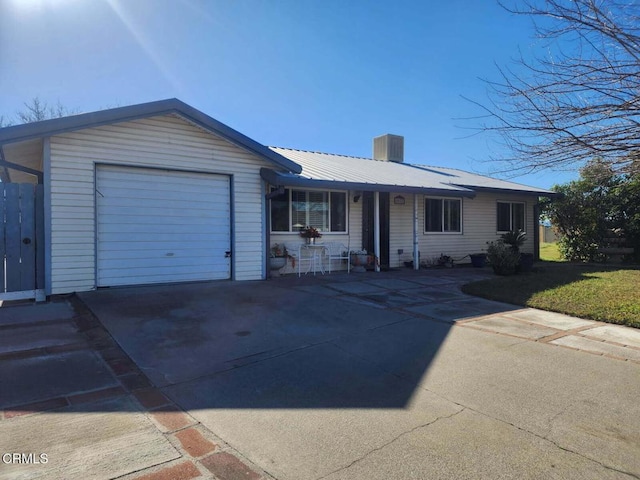 ranch-style home featuring a garage