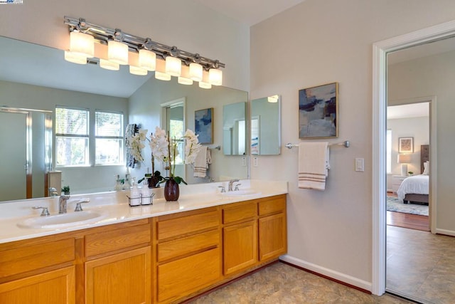 bathroom with walk in shower and vanity