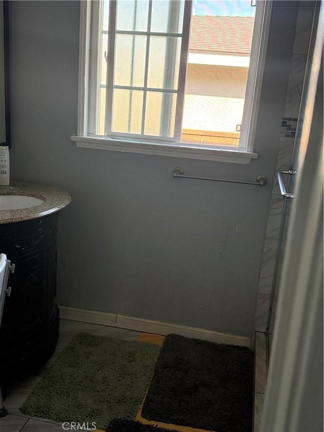 bathroom with vanity and a wealth of natural light