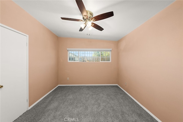 carpeted empty room featuring ceiling fan