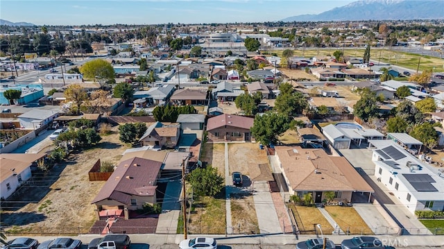 birds eye view of property with a mountain view