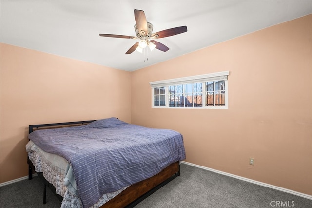 bedroom featuring ceiling fan and carpet