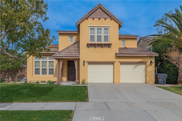 view of property featuring a garage and a front lawn