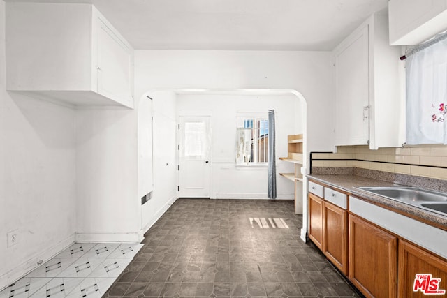 kitchen with sink and tasteful backsplash