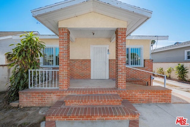 entrance to property with covered porch