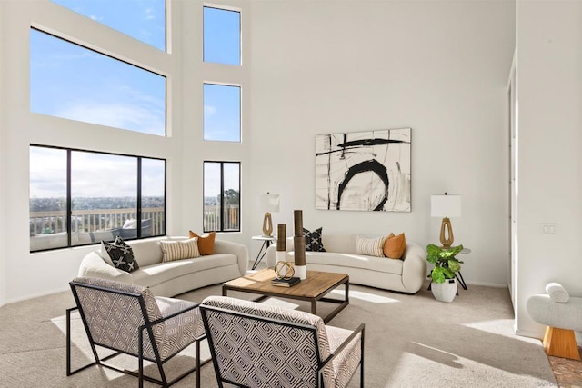 living room featuring a high ceiling and light carpet