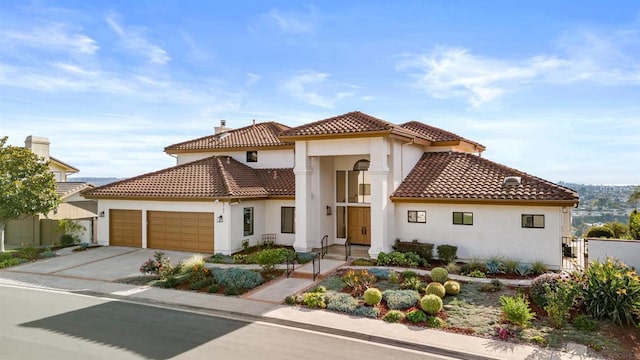 mediterranean / spanish-style home featuring a garage