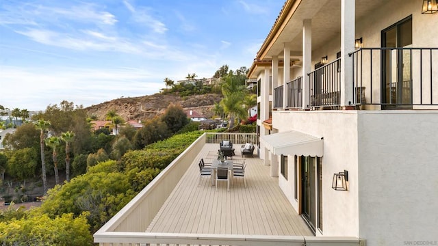 wooden terrace featuring a mountain view