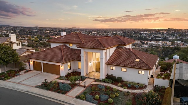 mediterranean / spanish-style house with a garage