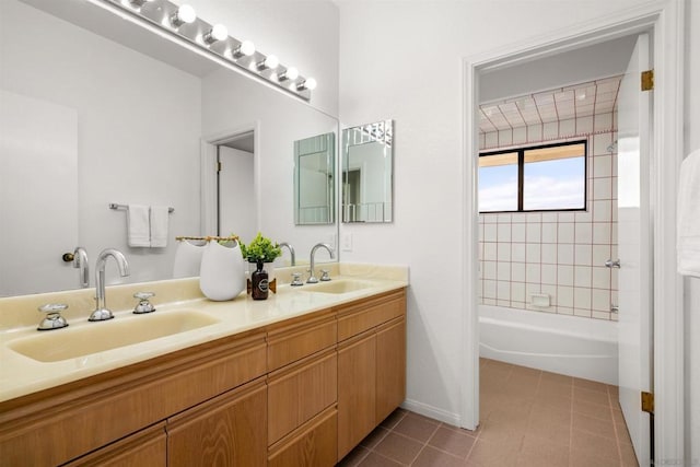 bathroom featuring vanity, tiled shower / bath combo, and tile patterned floors