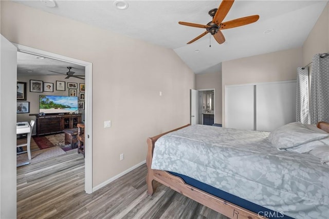 bedroom featuring lofted ceiling, hardwood / wood-style flooring, and ceiling fan