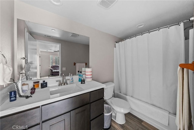 full bathroom with shower / bath combination with curtain, vanity, toilet, and hardwood / wood-style floors