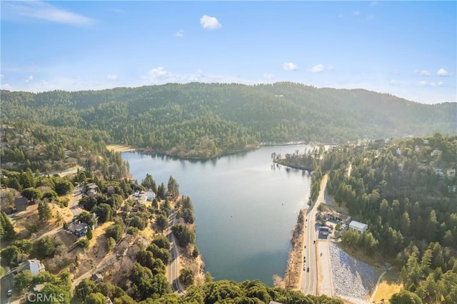 aerial view featuring a water and mountain view