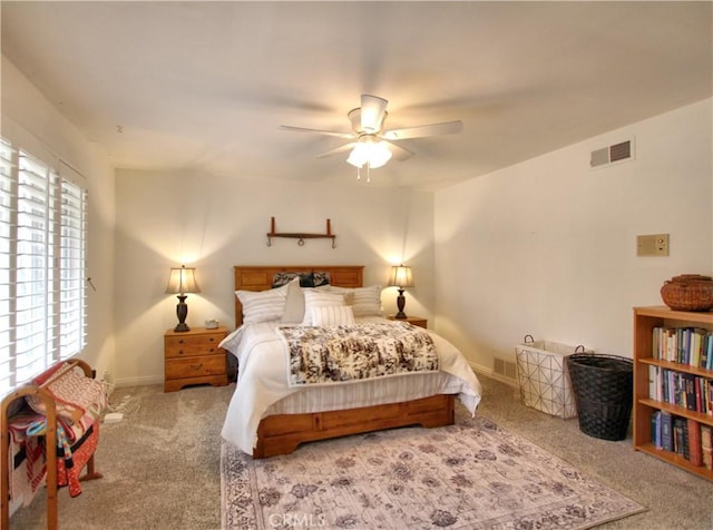 bedroom featuring ceiling fan and light carpet