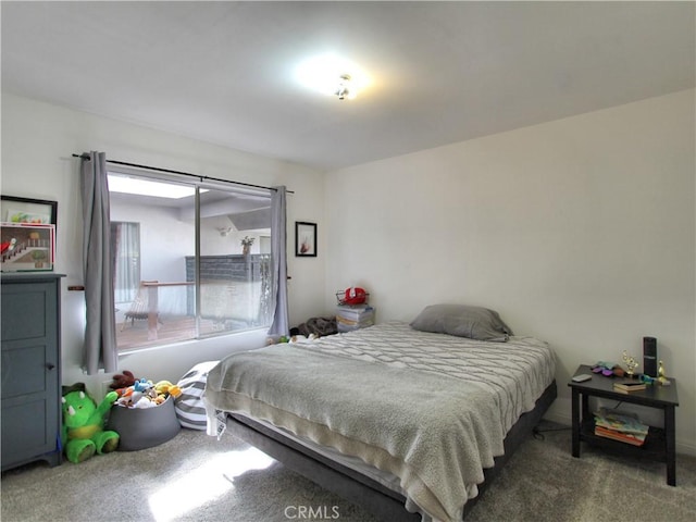 bedroom with dark colored carpet