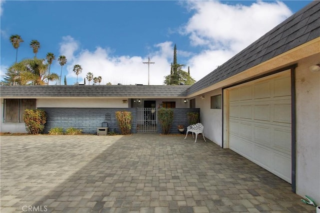 view of front of property with a garage