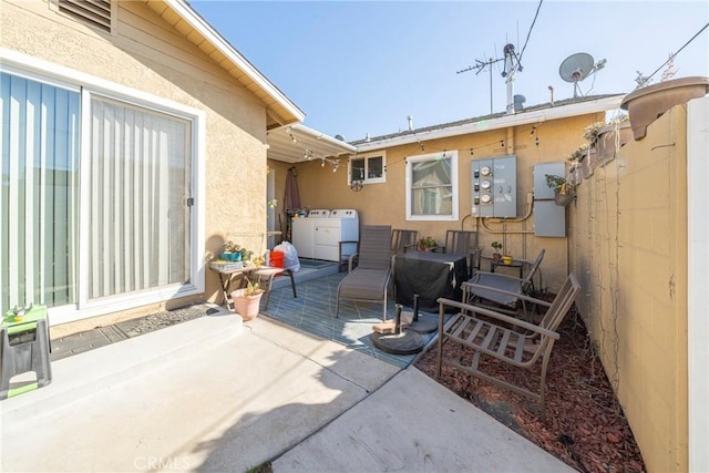 view of patio featuring separate washer and dryer