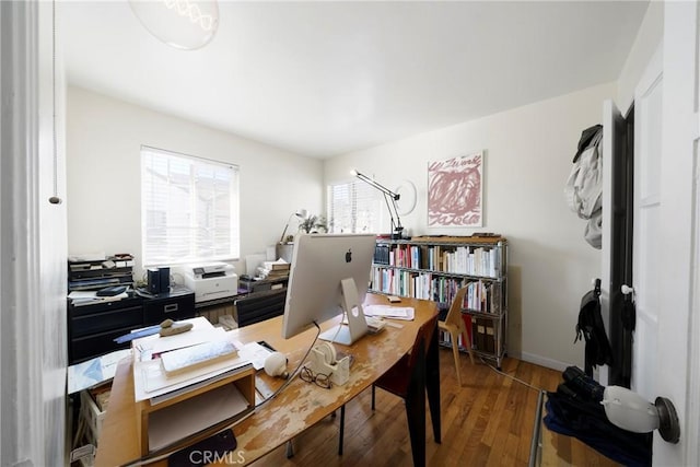 home office with hardwood / wood-style floors