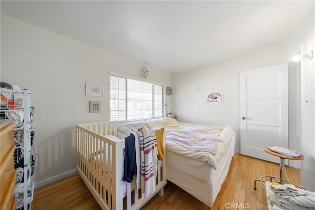 bedroom featuring wood-type flooring