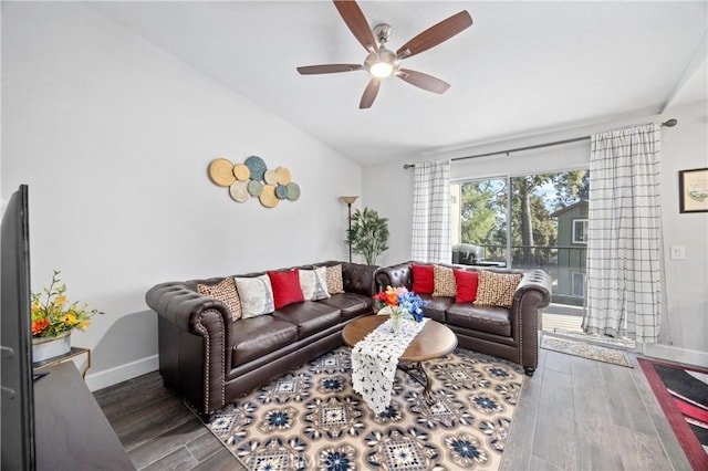 living room with dark wood-type flooring and ceiling fan