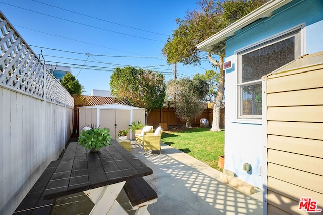 view of patio featuring a storage unit