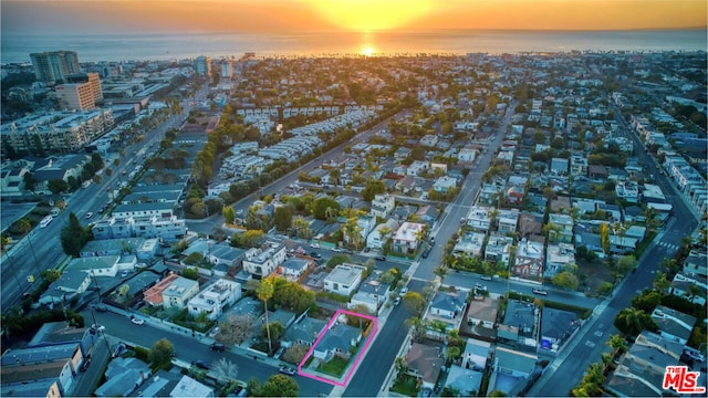 aerial view at dusk with a water view