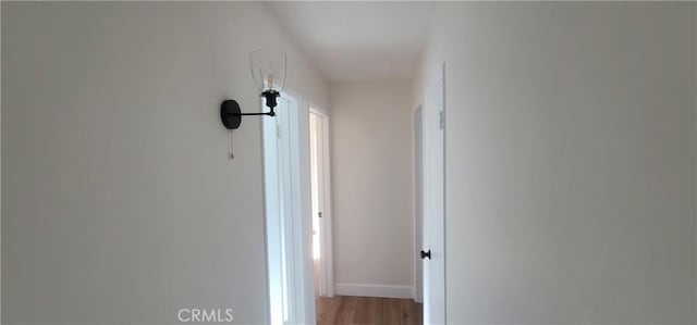 hall with light hardwood / wood-style flooring