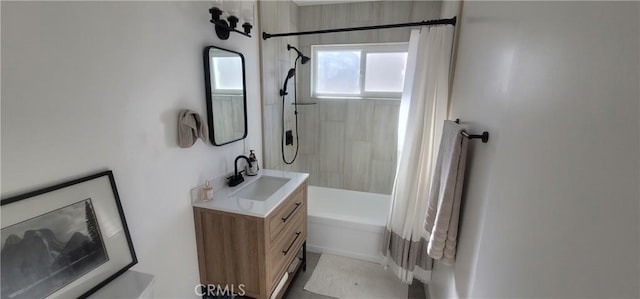 bathroom with vanity and shower / bath combo