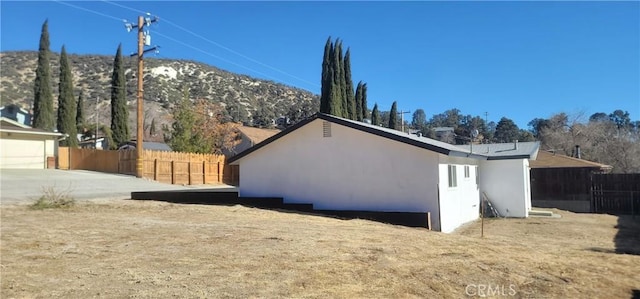 view of home's exterior with a mountain view