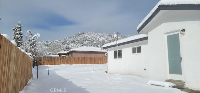 view of yard covered in snow