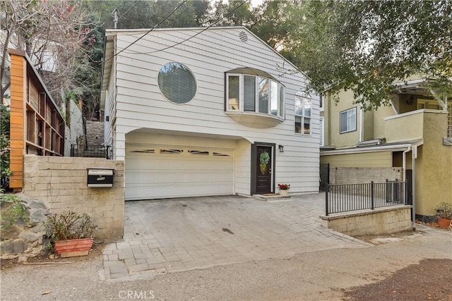 view of front of home with a garage