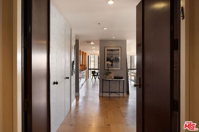 corridor featuring light parquet floors